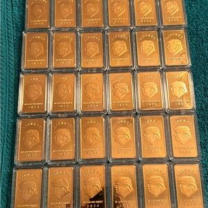 TRUMP collection gold bars.                      ONE TROY OUNCE .999 Fine Clad
